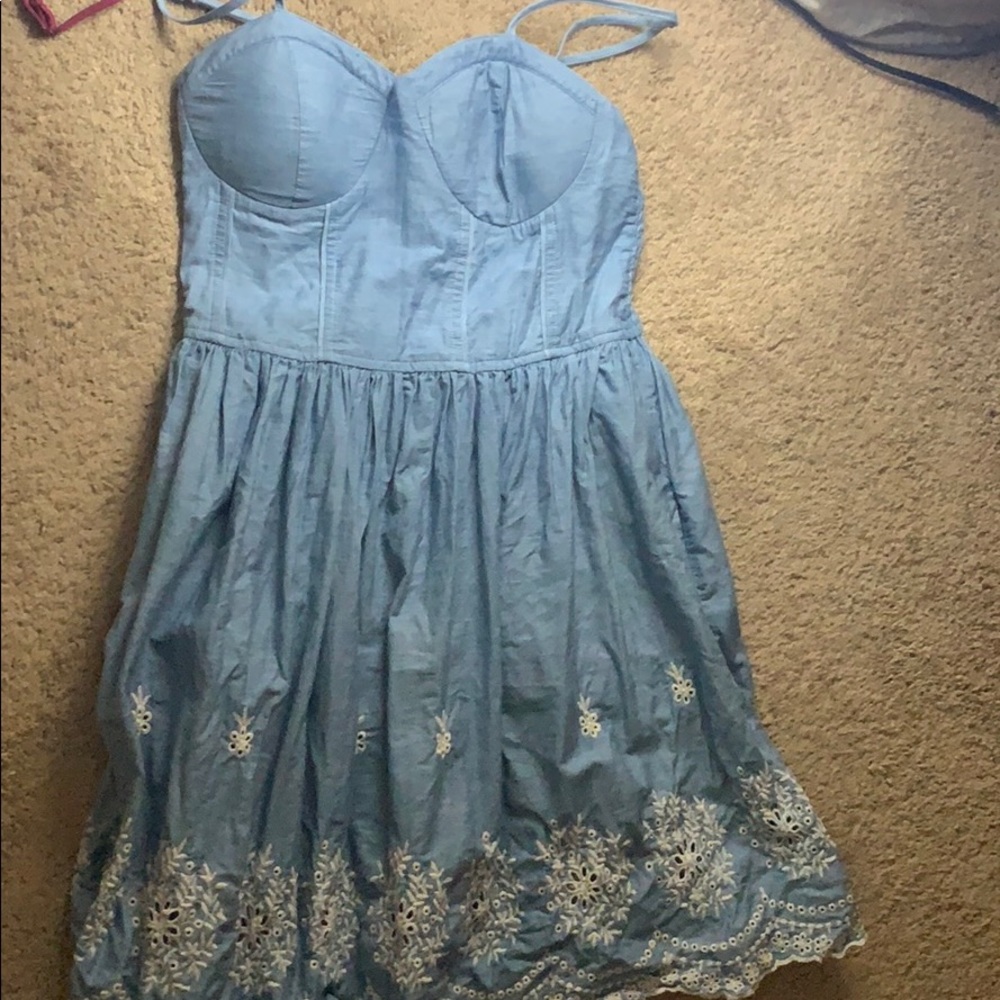 An eyelet embroidered dress in a  light levi color